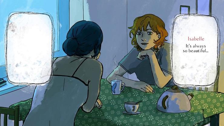 two women having a conversation at a green kitchen table